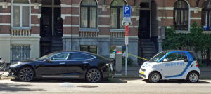 Tesla Model S (left) and Smart ED (right) charging in Amsterdam